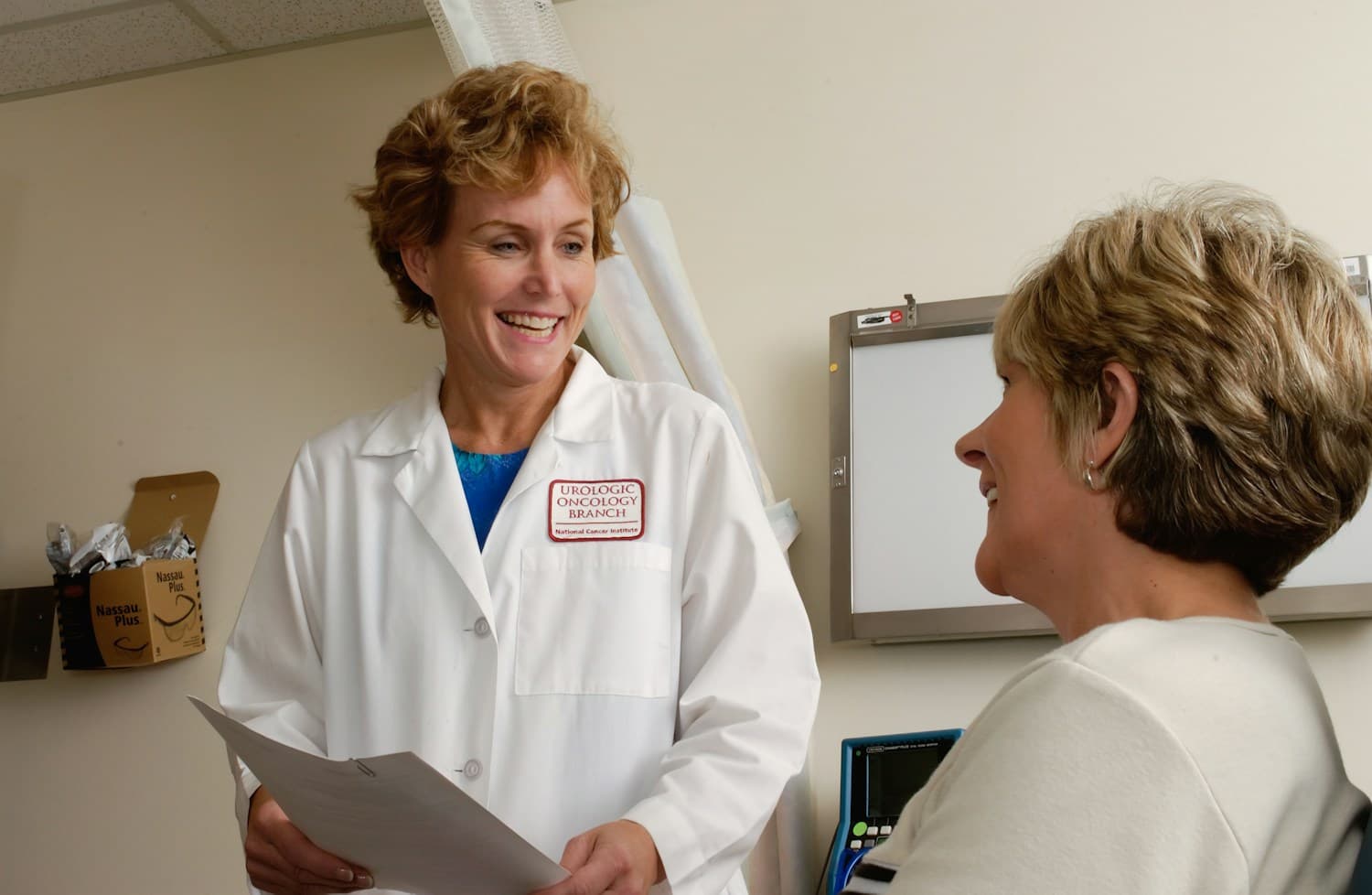 A physician speaking with a patient during a consultation